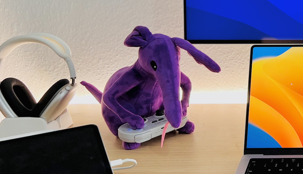 &ldquo;A photo of Anika, an ant-eater plushy sitting on my desk acting as my &ldquo;debugging rubberduck&rdquo;